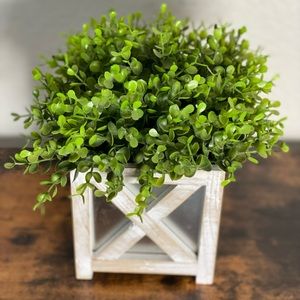 Faux plant in white and silver farmhouse style planter.